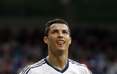 Cristiano Ronaldo puts on a silly face and his tongue out, during a match for Real Madrid in 2013