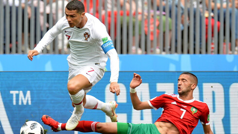 Cristiano Ronaldo getting past a defender in Portugal's fixture against Morocco