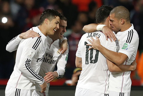 Cristiano Ronaldo celebrating a Real Madrid goal with his teammates