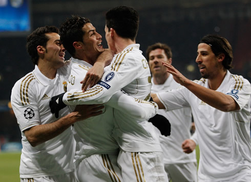 Cristiano Ronaldo holding Callejón and Arbeloa, while Khedira and Xabi Alonso join the celebrations, after Real Madrid gets the lead over CSKA, in 2012