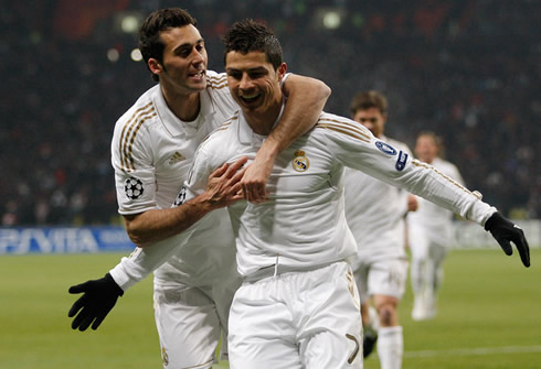 Cristiano Ronaldo smiling and celebrating Real Madrid goal with Alvaro Arbeloa, in a UEFA Champions League match in 2012