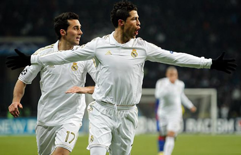 Cristiano Ronaldo making a funny face while he runs with his arms wide open in Real Madrid 2012