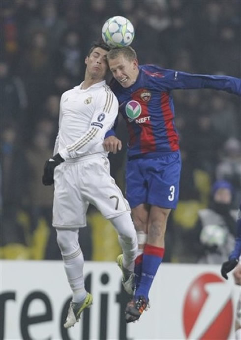 Cristiano Ronaldo jumping and heading a CSKA's defender head, while trying to go after the ball