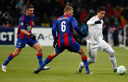 Cristiano Ronaldo dribbling CSKA defender, Berzutski, in a Real Madrid game in 2012
