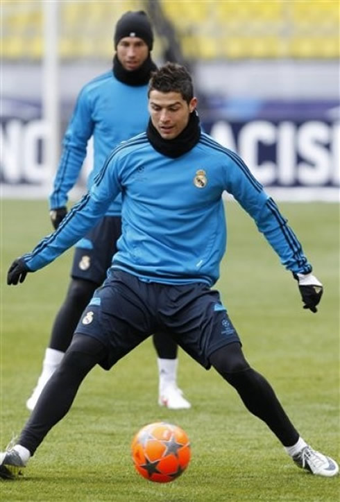 Cristiano Ronaldo in a Real Madrid training in Moscow (Russia), wearing black tights and playing with an orange soccer ball