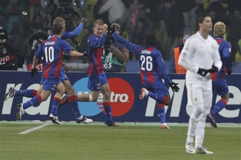 Cristiano Ronaldo looks to the Real Madrid bench, while CSKA Moscow players run to celebrate their goal on his back