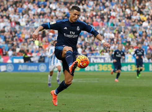 Cristiano Ronaldo getting the ball under control, in Malaga 1-1 Real Madrid