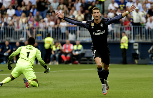 Cristiano Ronaldo opens his arms and turns to Real Madrid bench after putting Real Madrid on the lead against Malaga