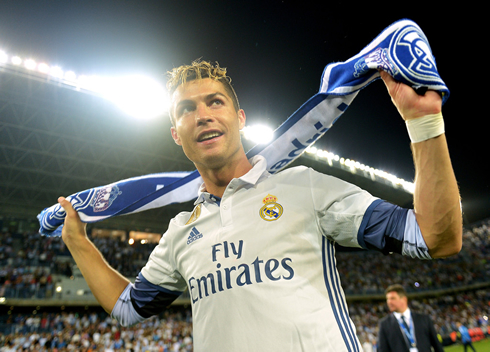 Cristiano Ronaldo puts a Real Madrid scarf around his neck as Real Madrid celebrate La Liga title in 2017