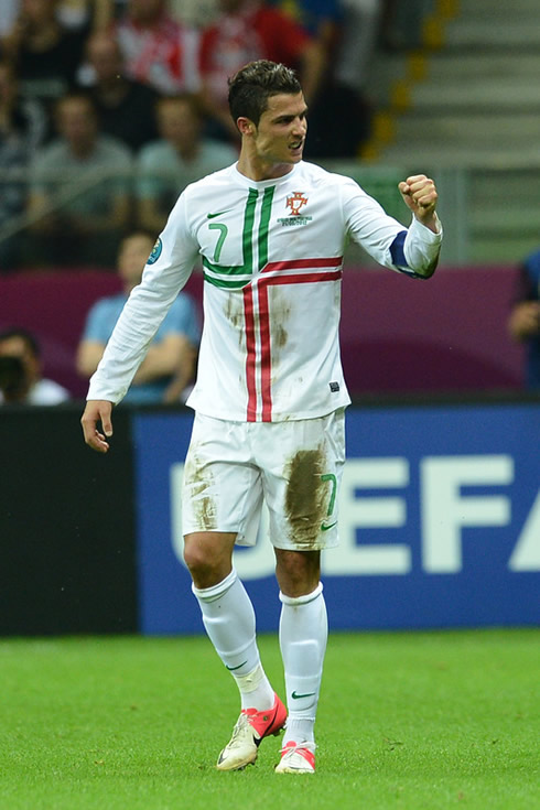 Cristiano Ronaldo grinding his teeth as he raises his left fist to celebrate Portugal victory in the EURO 2012