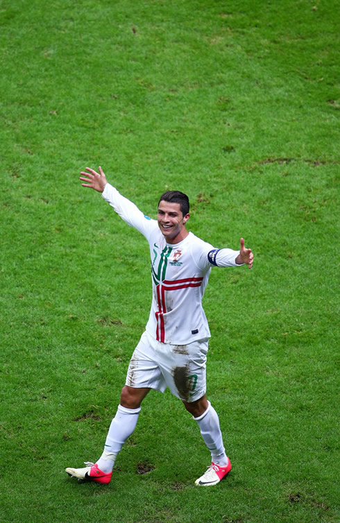 Cristiano Ronaldo smiling and opening his arms during a game for Portugal at the Euro 2012