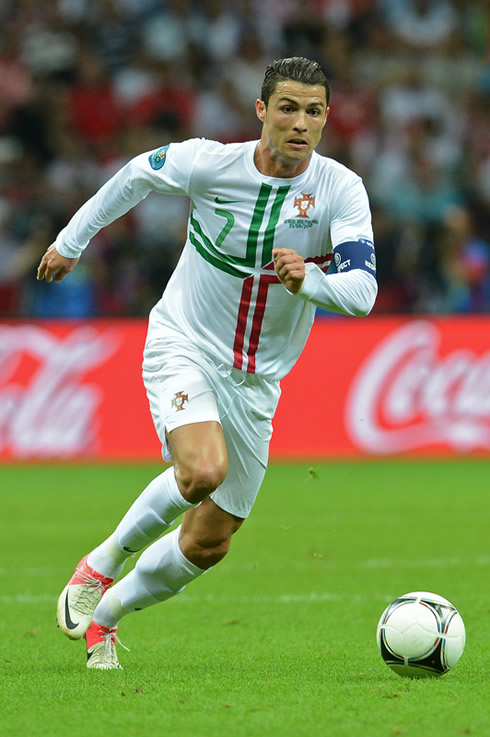 Cristiano Ronaldo running with the ball in a game between Portugal and the Czech Republic, at the EURO 2012
