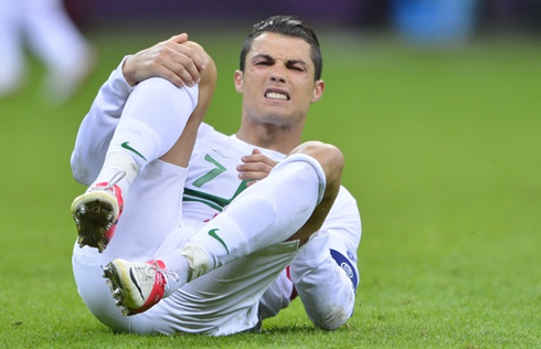 Cristiano Ronaldo hurt and with pain on the ground, at the EURO 2012