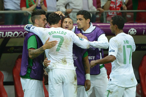 Cristiano Ronaldo hugging Ricardo Quaresma and Miguel Lopes, with Ricardo Costa and Nani getting near by, at the EURO 2012