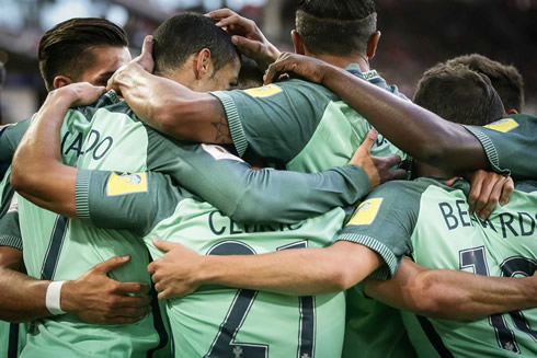 Portugal players gathered around and hugging each other