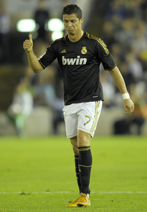 Cristiano Ronaldo looking upseted with something and showing thumbs up in Racing Santander vs Real Madrid, La Liga match in 2011-2012