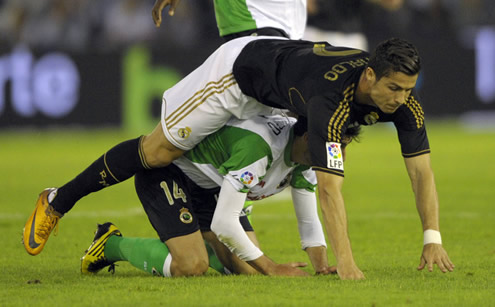 Cristiano Ronaldo falling over a defender in Racing Santander vs Real Madrid, La Liga match in 2011-2012