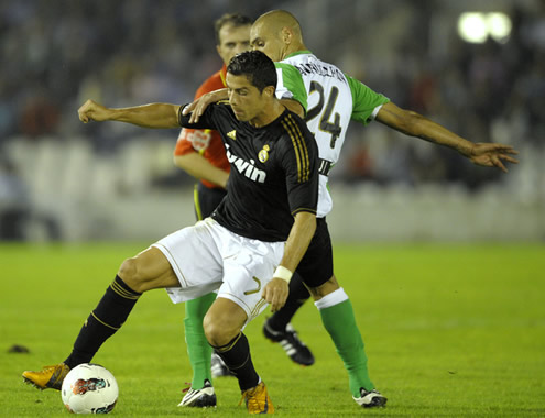 Cristiano Ronaldo fighting for the ball in Racing Santander vs Real Madrid, La Liga match in 2011-2012
