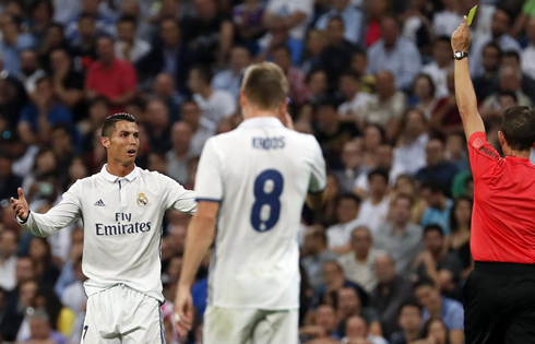 Cristiano Ronaldo being shown the yellow card