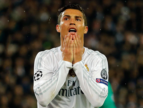 Cristiano Ronaldo holds his chin in despair, in a Champions League match