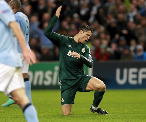 Cristiano Ronaldo complaining with the referee in a UEFA Champions League match between Manchester City and Real Madrid, in 2012-2013