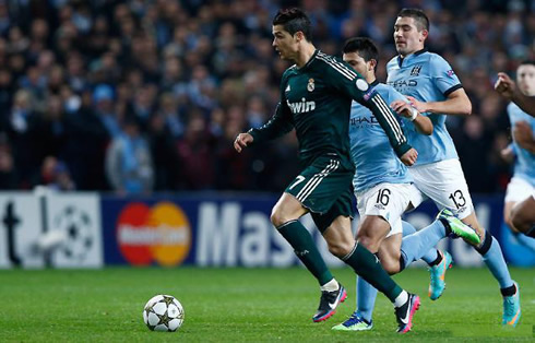 Cristiano Ronaldo vs Manchester City, with several defenders chasing him, in Champions League 2012-2013