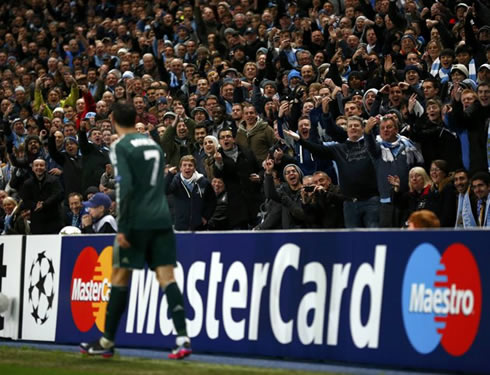 Cristiano Ronaldo looking at the Manchester City fans reactions after going down on the pitch, in a Real Madrid game at the UEFA Champions League 2012-2013