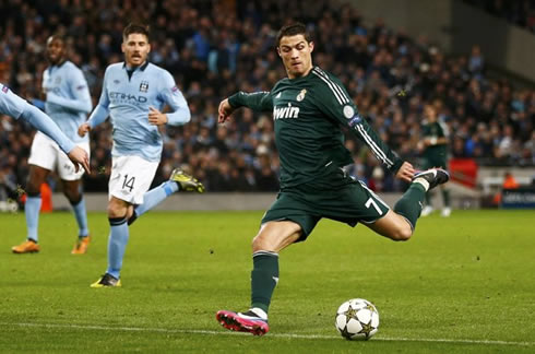Cristiano Ronaldo left-foot strike, in Manchester City vs Real Madrid in 2012-2013, with Javi Garcia looking to the ball a few meters away