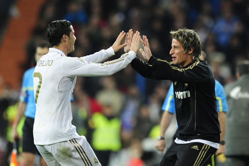 Cristiano Ronaldo celebrates the remontada against Athletic Bilbao by touching hands with another Portuguese football player, Fábio Coentrão