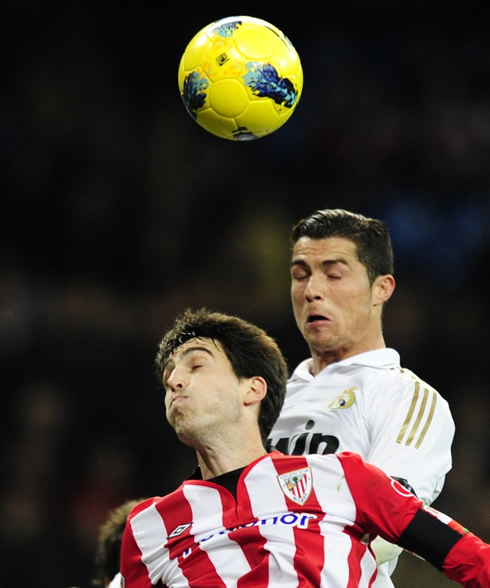 Cristiano Ronaldo rising above a defender to head the ball