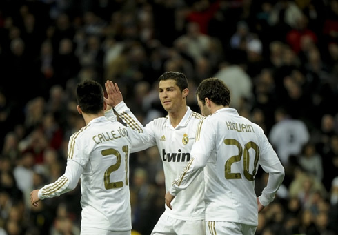 Cristiano Ronaldo being congratulated by Granero and Higuaín after scoring his 23th goal in La Liga 2011-2012