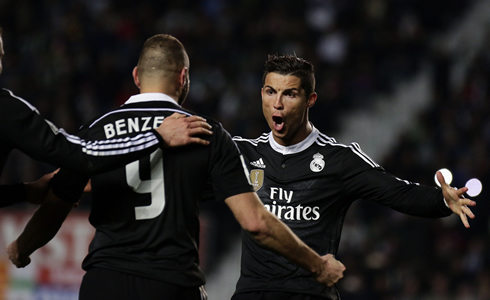 Cristiano Ronaldo screams and shouts as he waits to hug Karim Benzema