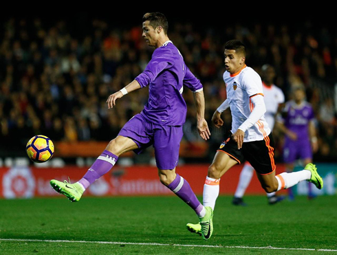 Cristiano Ronaldo tries to chip the ball with his right foot