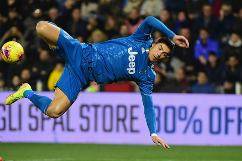 Cristiano Ronaldo losing his balance and falling on the pitch