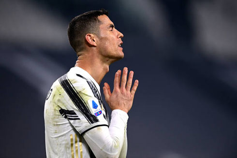 Cristiano Ronaldo praying during a football game