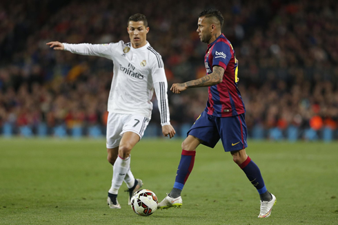 Cristiano Ronaldo in a defensive action near Daniel Alves