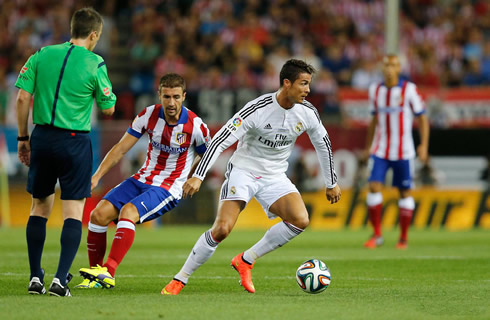 Cristiano Ronaldo running away from Gabi, in Atetico Madrid vs Real Madrid for the Spanish Super Cup 2014