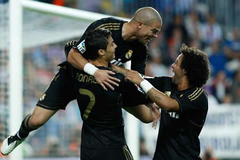Cristiano Ronaldo celebrating a goal with Pepe and Marcelo