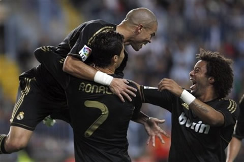 Cristiano Ronaldo holds Pepe and laughs, with Marcelo near them