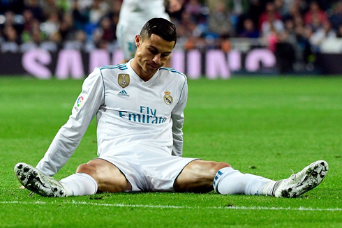 Cristiano Ronaldo showing his frustration seated on the ground