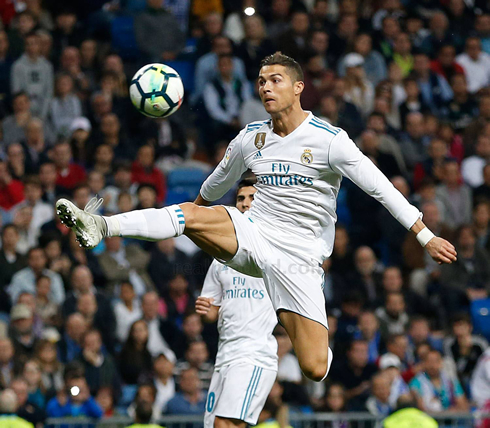Cristiano Ronaldo attempting to control a ball in the air