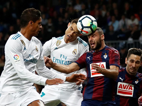 Cristiano Ronaldo almost clashing heads with an opponent in a game between Real Madrid and Eibar
