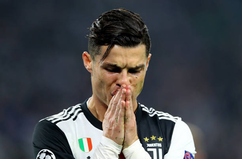 Cristiano Ronaldo praying during a football game