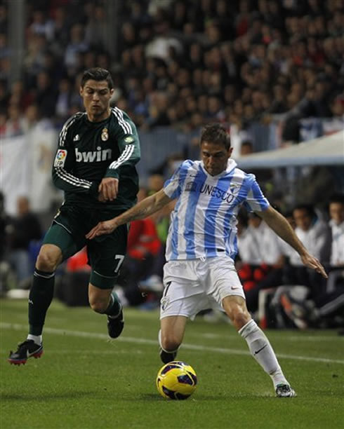 Cristiaon Ronaldo fighting for the ball with Joaquín, in Malaga 3-2 Real Madrid, for La Liga 2012-2013