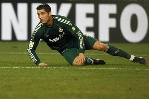 Cristiano Ronaldo preparing to stand up in a game for Real Madrid