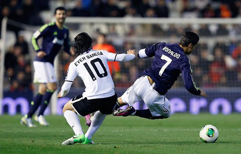 Cristiano Ronaldo being tackled and fouled by Ever Banega, in Valencia 1-1 Real Madrid, for the Copa del Rey quarter-finals in 2013