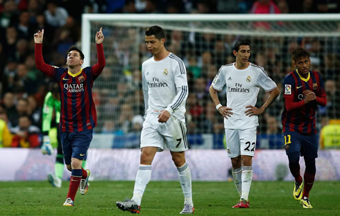 Cristiano Ronaldo puts his head down as Messi and Neymar celebrate Barcelona goal near him