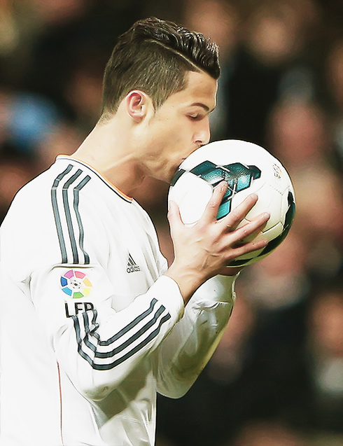 Cristiano Ronaldo kissing the football before taking a penalty-kick