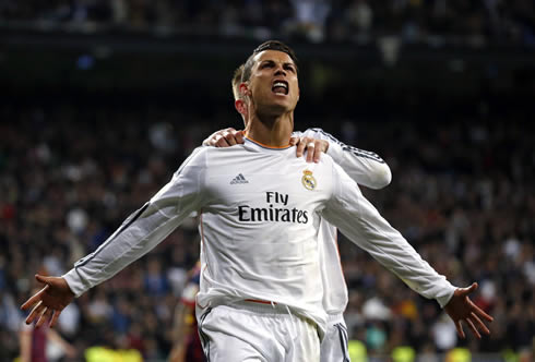 Cristiano Ronaldo with his arms open, celebrating Real Madrid goal against Barça, in the first Clasico of 2014