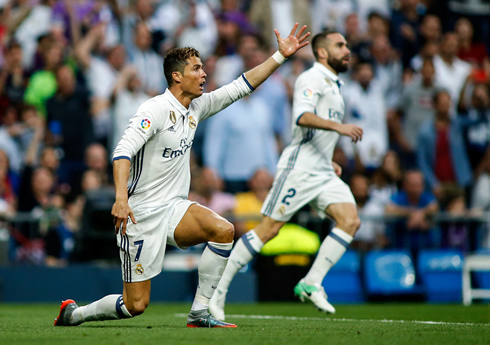 Cristiano Ronaldo down in one knee, with penalty shouts to the referee